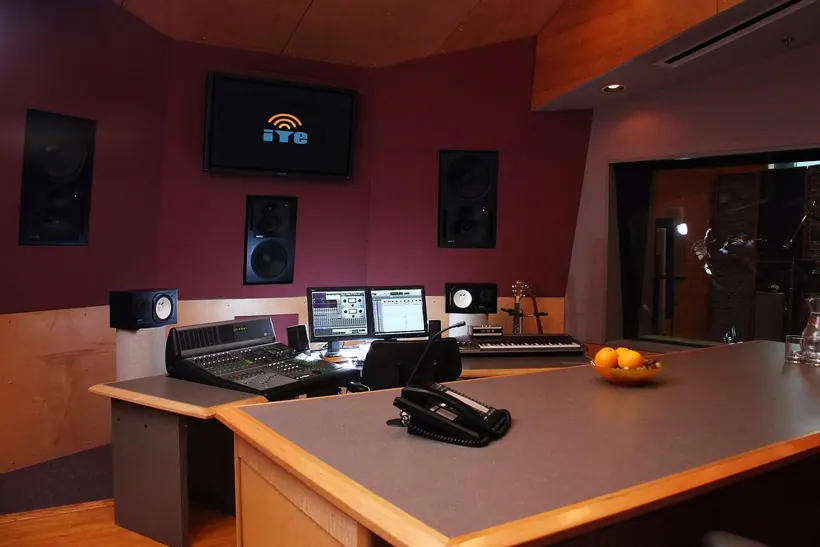 Audio post-production control room with mixing console