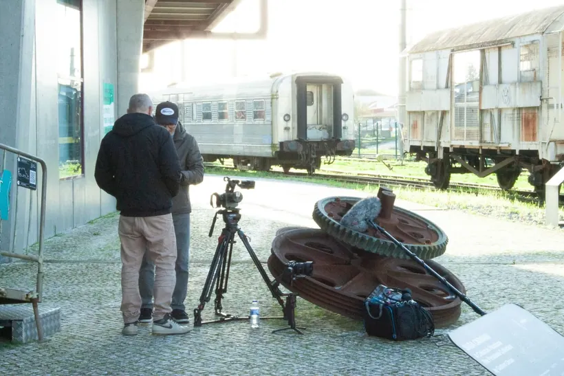 Camera crew preparing equipment on location