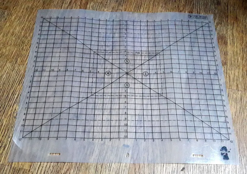 Animator’s translucent layout sheet with field guides and peg holes